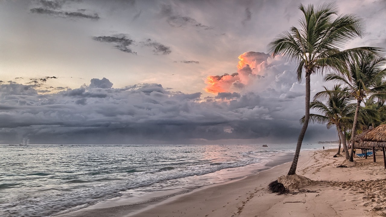 tropical humid beach with sand, see and clouds 