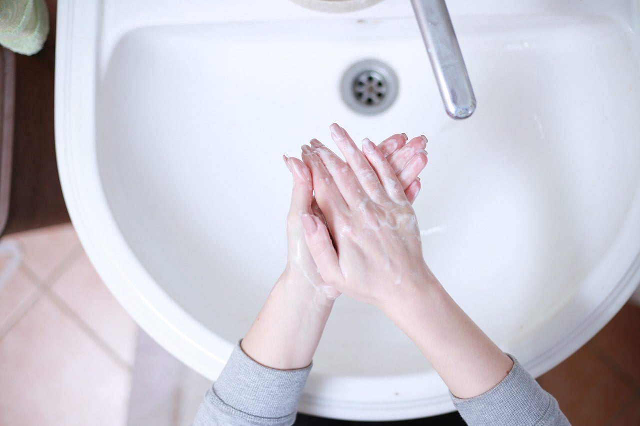 washing hands in the sink