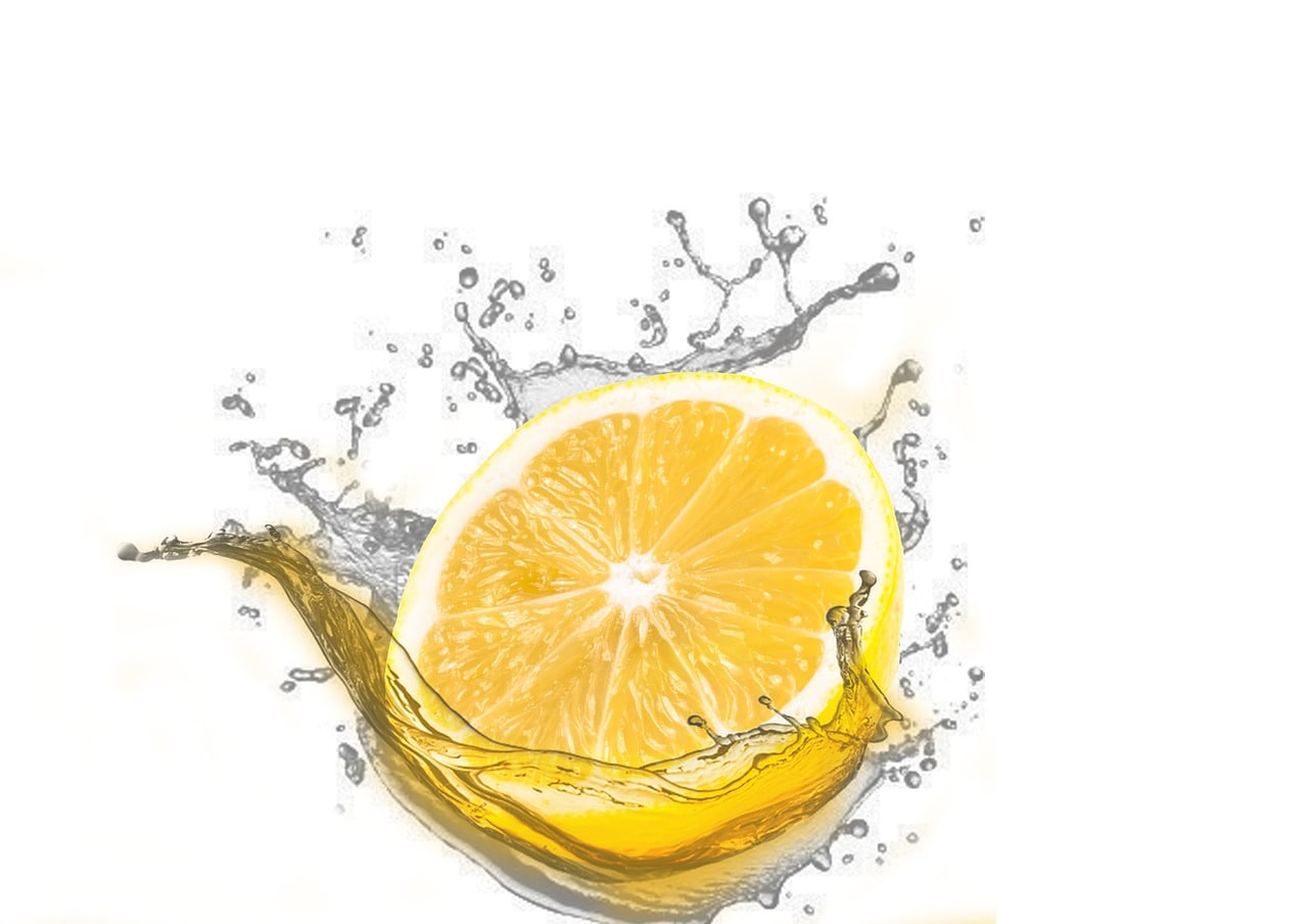 a lemon splashing in water