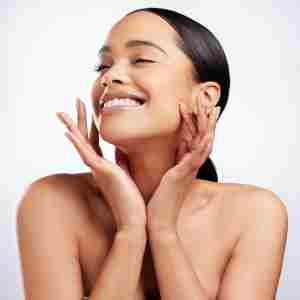 a woman is happy with her brightening skin